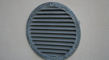 A free flowing air vent lets fresh air into an outhouse.