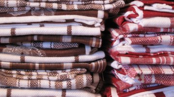 Kitchen towels help to clean cloudy wine glasses.