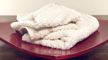 Use white cloths to remove dye stains so you can see how much stain you've removed.