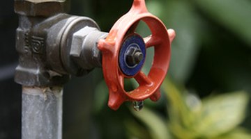 Water supply valve located halfway up a pipe.