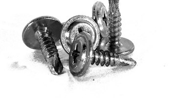 Self-tapping screws drill through the door clips and studs easily.
