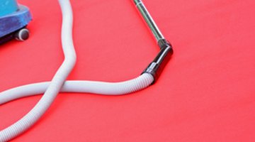 Use a vacuum cleaner with a hose attachment.