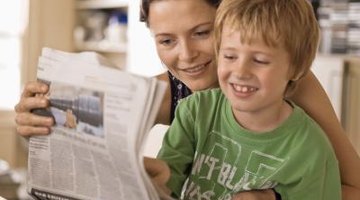 Mother and son reading paper