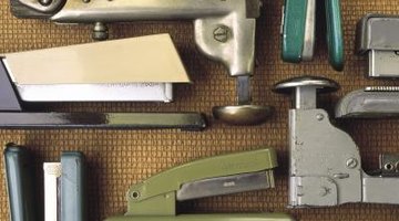 different old school staplers