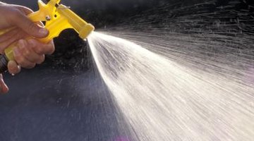 rinse exterior bricks with a garden hose