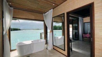 Aspect of a wooden home alongside the water