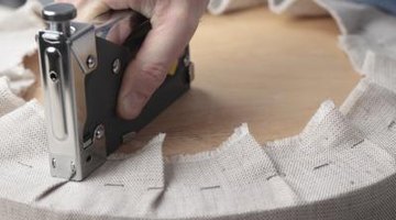 man using a stapler