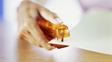 woman holding stapler