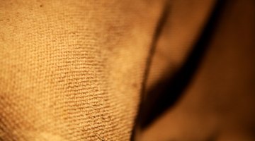 An inexpensive and effective wind barrier can be constucted from burlap and stakes.