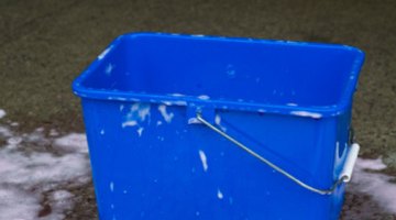 A mild soap solution safely cleans leather surfaces.