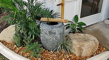 Pour the stones and add the bamboo fixture.