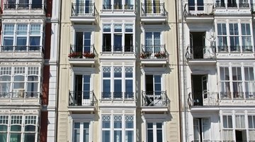 Housing complexes often have records of the original installation of materials.