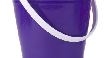 Use a large enough bucket to fully submerge each garment in the white vinegar.