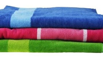 Absorbent towels remove excess moisture from wool garments.
